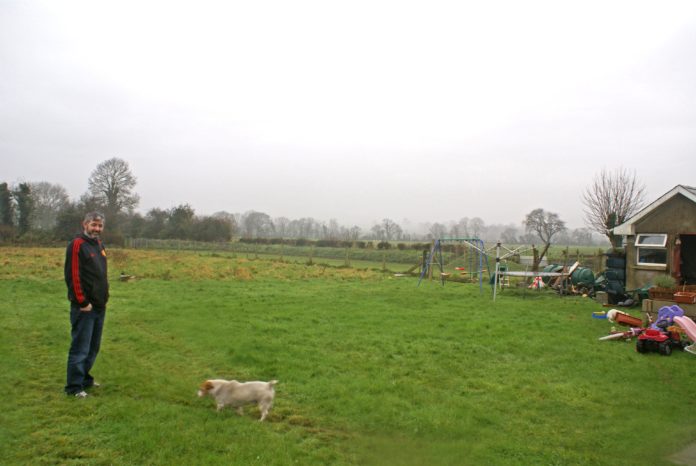 S129800-masterimage-R8491-paul-philpott-at-the-rear-of-his-property-outside-fermoy-which-was