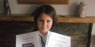 Sarah-Jane receives her certs from the Little Princess Trust