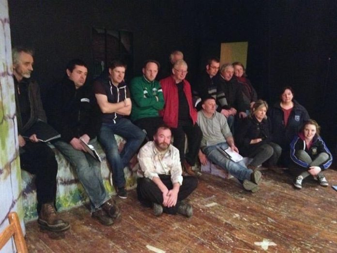 The group taking a well earned break during rehearsals.