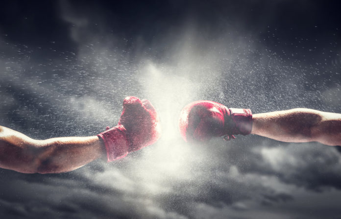 Two boxing gloves punch. Box and fight