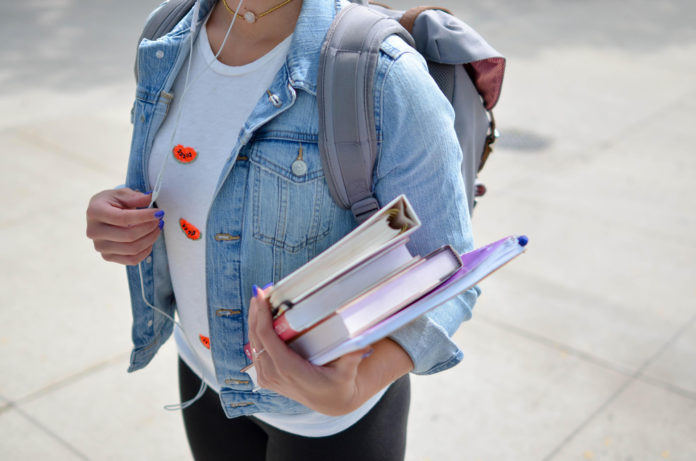Student with books Web Stock@30-06-2021-22:02:38.jpg