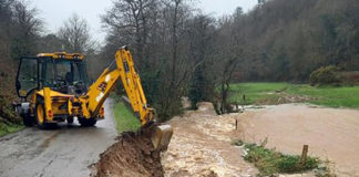 Road collapses into river