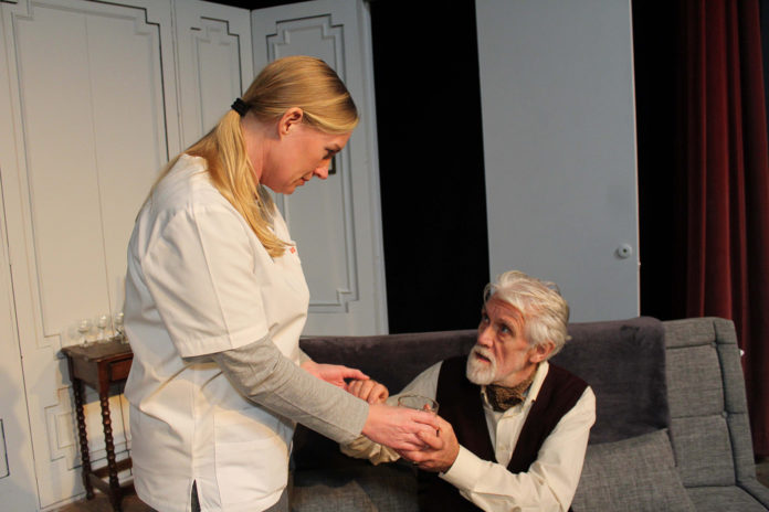 Sean Ahern and Emma Walsh rehearsing a scene from 'The Father'.