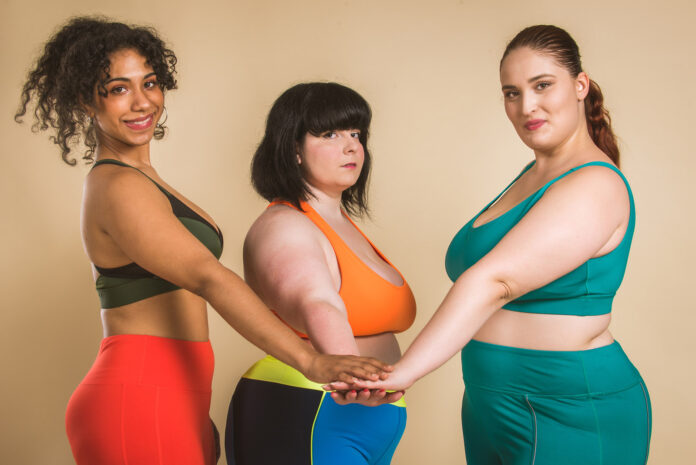 Plus size women posing for body acceptance