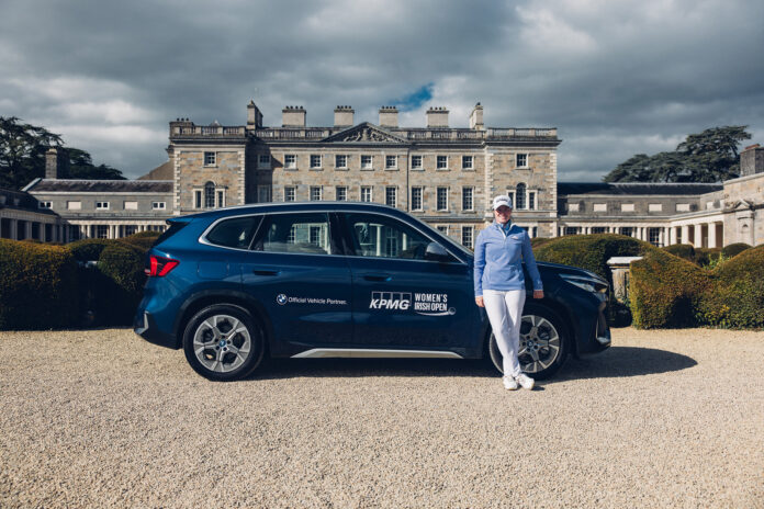 Leona Maguire with the BMW iX1 outside Carton House. (Picture: Paddy McGrath)