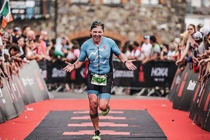 Terry Broderick, pictured at the finish line of an Ironman competition.